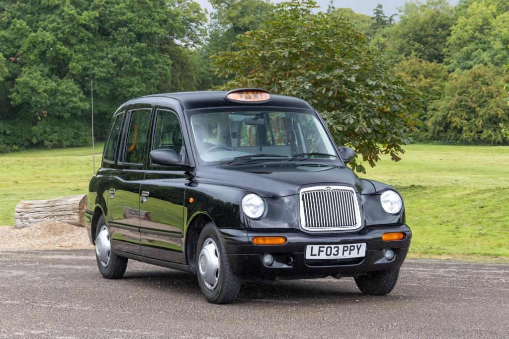 LONDON TAXIS INTERNATIONAL TXII London Taxis International TX2 Gold Taxicab 2003